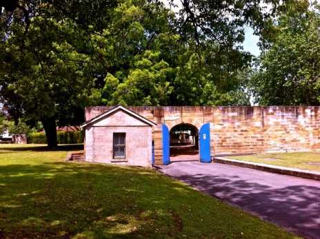 The small building to the left of the big blue doors was the “dead house” at the Parramatta Female Factory. Photo: Michaela Ann Cameron (2014)